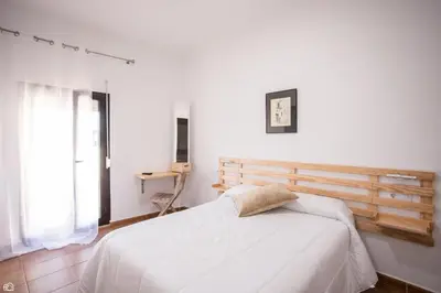 Cama o camas de una habitación en Hostal Rio