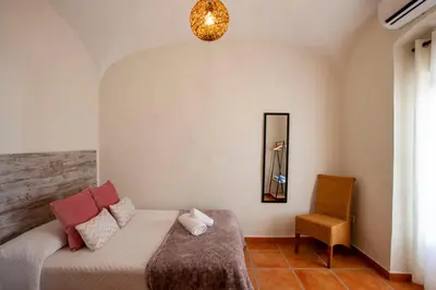 Cama o camas de una habitación en Casa Rural La Salamandrija- con chimenea, patio y barbacoa
