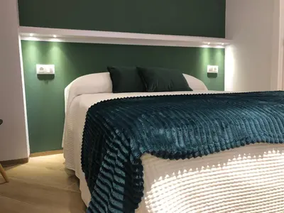 Cama o camas de una habitación en Hostal León