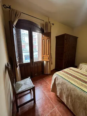 Cama o camas de una habitación en Apartamentos Turísticos La Posada