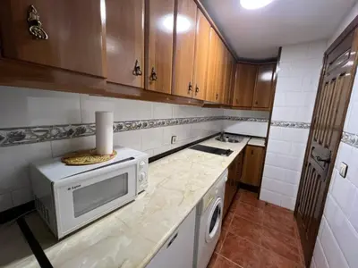 Una cocina o zona de cocina en Apartamentos Turísticos La Posada