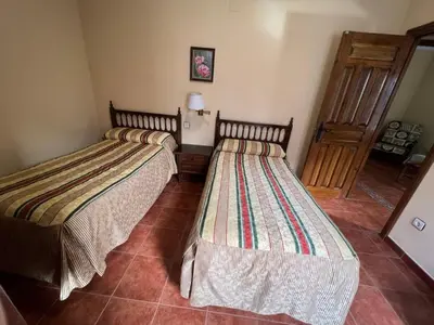 Cama o camas de una habitación en Apartamentos Turísticos La Posada