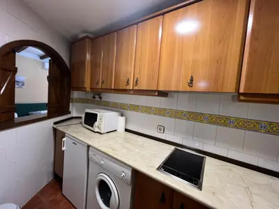 Una cocina o zona de cocina en Apartamentos Turísticos La Posada