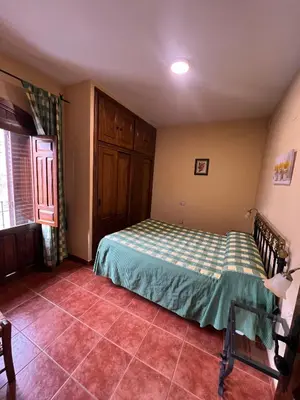 Cama o camas de una habitación en Apartamentos Turísticos La Posada