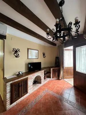 Una televisión o centro de entretenimiento en Apartamentos Turísticos La Posada