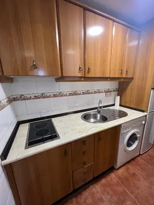 Una cocina o zona de cocina en Apartamentos Turísticos La Posada