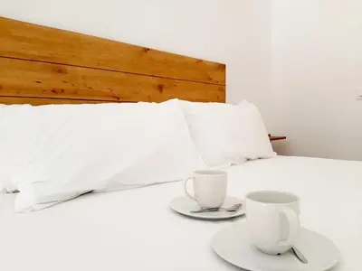 Cama o camas de una habitación en Apartamentos Candelario by gaiarooms