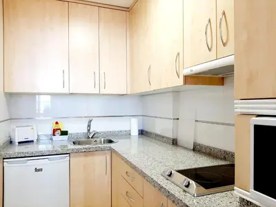 Una cocina o zona de cocina en Apartamentos Candelario by gaiarooms