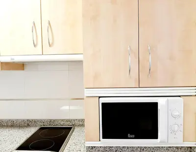 Una cocina o zona de cocina en Apartamentos Candelario by gaiarooms