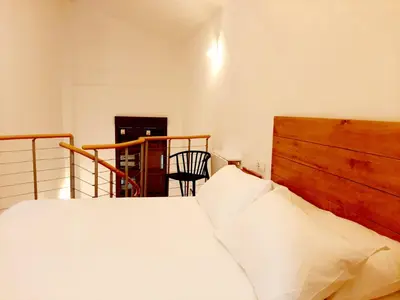 Cama o camas de una habitación en Apartamentos Candelario by gaiarooms