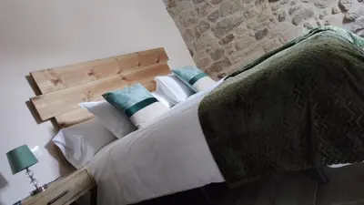Cama o camas de una habitación en La Lagareta de Olivia