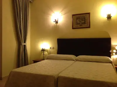 Cama o camas de una habitación en Hostal Cerezo 2