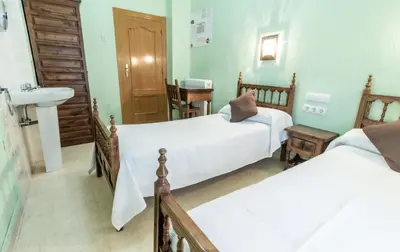 Cama o camas de una habitación en Pensión Virginia by Vivere Stays