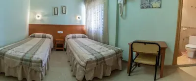 Cama o camas de una habitación en Pensión Isabel by Vivere Stays