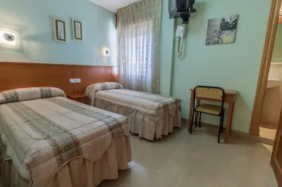 Cama o camas de una habitación en Pensión Isabel by Vivere Stays
