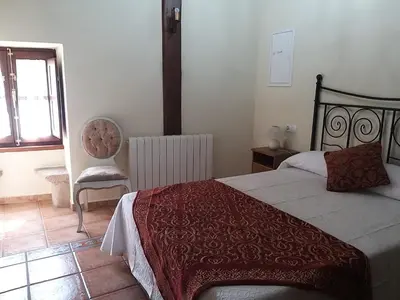 Cama o camas de una habitación en casa rural la Mariota