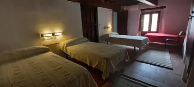 Cama o camas de una habitación en Albergue San Blas - Vía de la Plata y Cáparra - Vía Verde