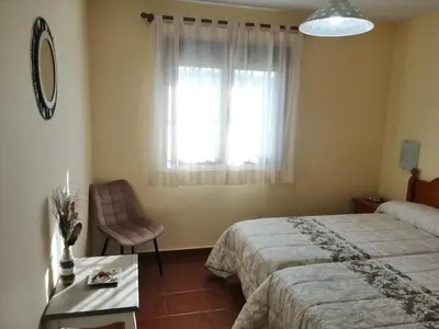 Cama o camas de una habitación en Alojamientos LUNADA