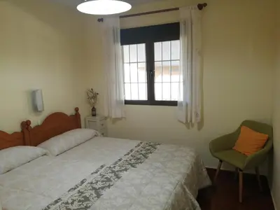 Cama o camas de una habitación en Alojamientos LUNADA