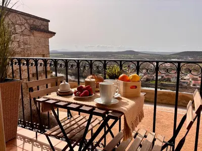 Un balcón o terraza de Apartamentos Adarve Centro histórico