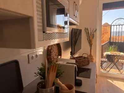 Una cocina o zona de cocina en Apartamentos Adarve Centro histórico