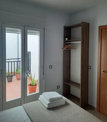 Cama o camas de una habitación en Apartamentos Clavero 10