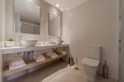 Un baño de ParrApartamentos Cáceres