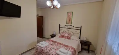 Cama o camas de una habitación en Casa Rural San Marcos