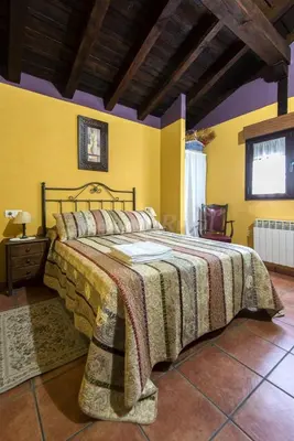 Cama o camas de una habitación en Casa Rural Laura