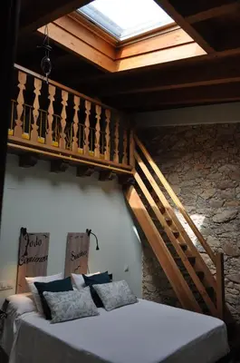 Cama o camas de una habitación en El Rincón Secreto de Gredos especializada en celiaquía y diabetes y jacuzzi