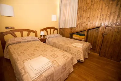 Cama o camas de una habitación en La Hospedería Del Silencio