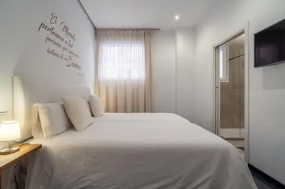 Cama o camas de una habitación en CMDreams Gold- Apartamentos turísticos con ruinas romanas en el centro de Mérida