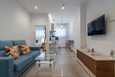 Una televisión o centro de entretenimiento en CMDreams Gold- Apartamentos turísticos con ruinas romanas en el centro de Mérida