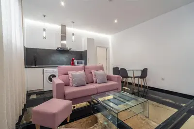 Una televisión o centro de entretenimiento en CMDreams Gold- Apartamentos turísticos con ruinas romanas en el centro de Mérida
