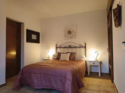 Cama o camas de una habitación en Pago de Yuste - Casa Rural Apartamentos