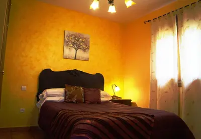 Cama o camas de una habitación en Pago de Yuste - Casa Rural Apartamentos
