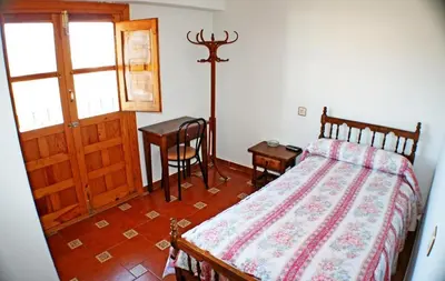 Cama o camas de una habitación en Mesón de Lagartera