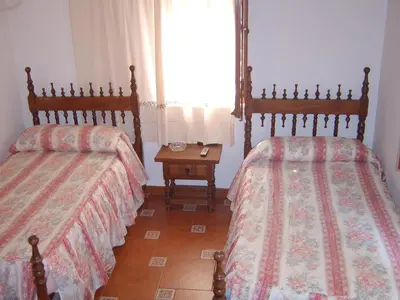 Cama o camas de una habitación en Mesón de Lagartera