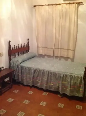 Cama o camas de una habitación en Mesón de Lagartera