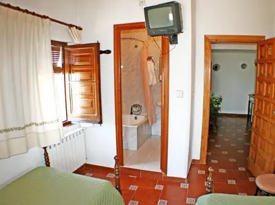 Cama o camas de una habitación en Mesón de Lagartera