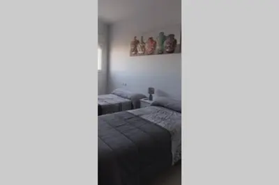 Cama o camas de una habitación en Apartamentos NayDa 2 habitaciones