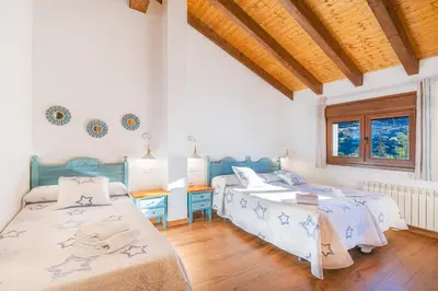 Cama o camas de una habitación en Casa Rural La Chopera del Jerte