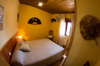 Cama o camas de una habitación en CASA DE PIEDRA