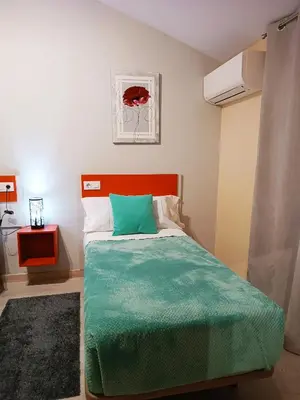 Cama o camas de una habitación en Hotel Alma Rosa