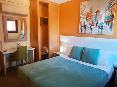 Cama o camas de una habitación en Hotel Alma Rosa