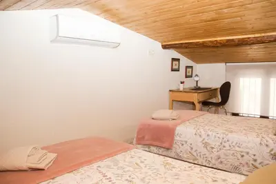Cama o camas de una habitación en LA CASITA DEL PORTAL