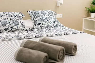 Cama o camas de una habitación en Estupendo Piso de 2 dormitorios en la Gran Vía. A/A. Wifi.