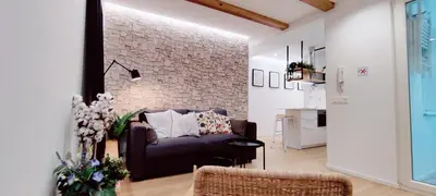 Zona de estar de Estupendo Piso de 2 dormitorios en la Gran Vía. A/A. Wifi.