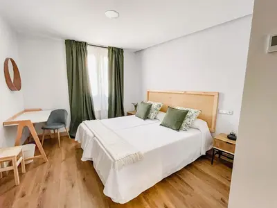 Cama o camas de una habitación en Hotel Camino de las Estrellas