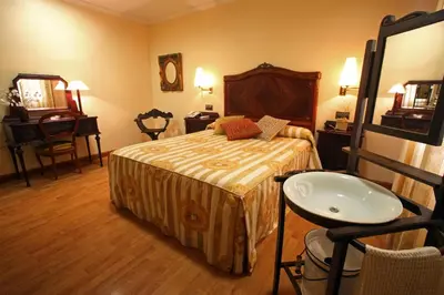 Cama o camas de una habitación en Hotel El Pentágono